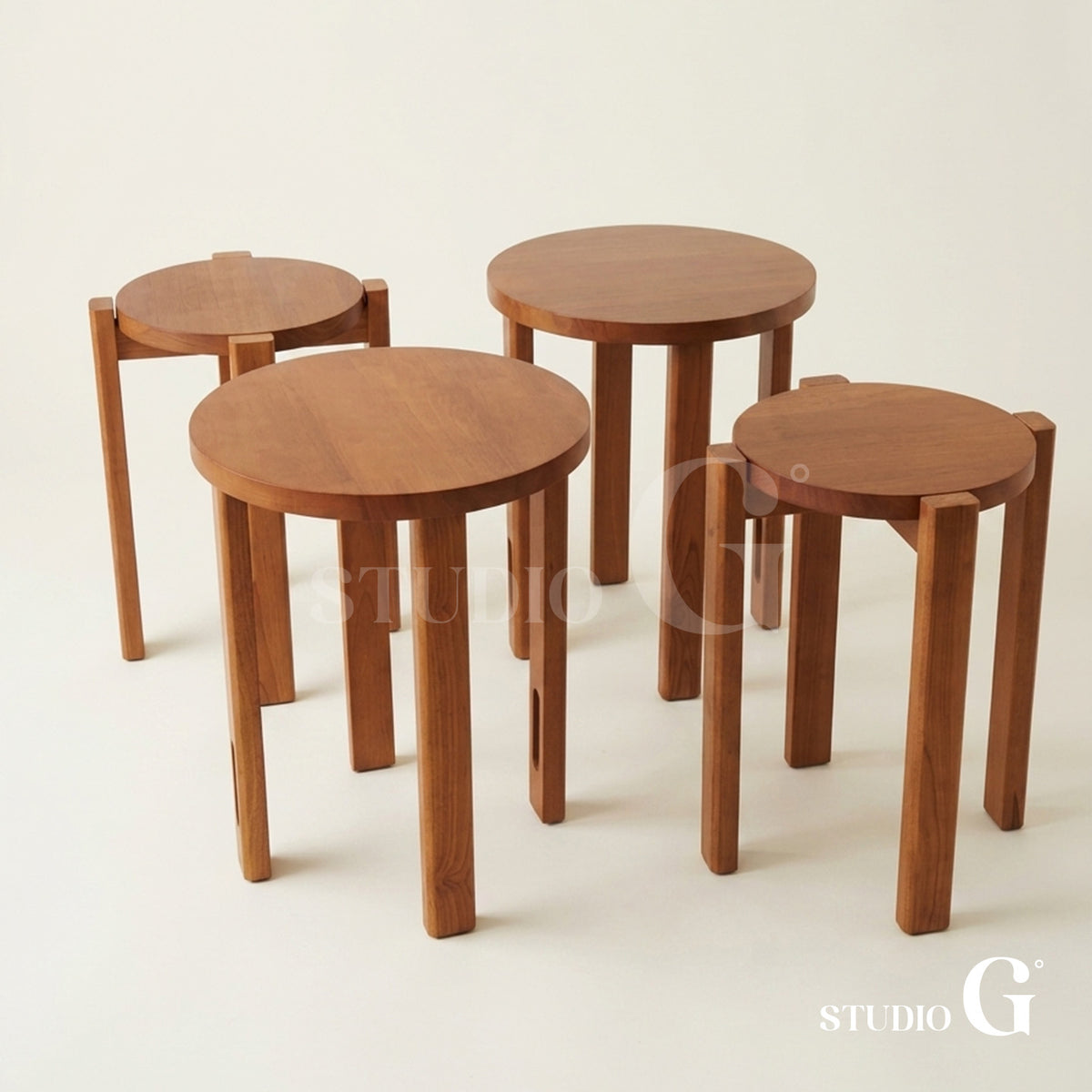 Four Light Brown solid wood stools set out separately